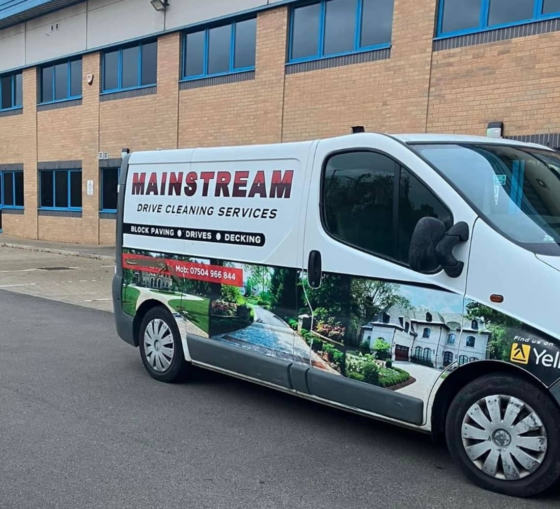 The Mainstream van parked on a business park beside a two-storey office building